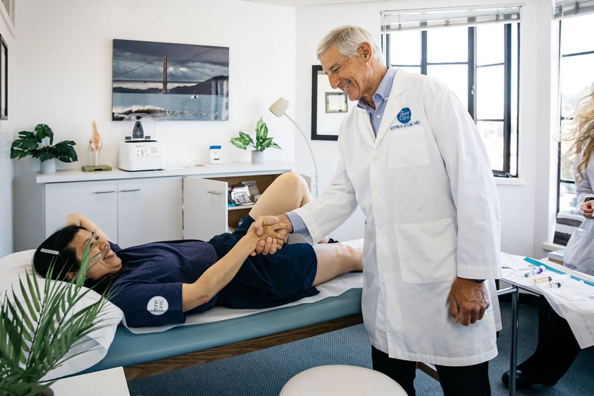 Dr. Kevin Stone Knee Surgeon with Patient