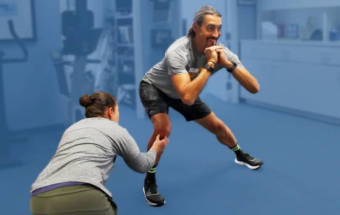 Athletic Trainer Coaching Rehab Patient at Physical Therapy Clinic San Francisco