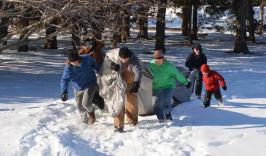 BioAnkle patient David collecting firewood with his family